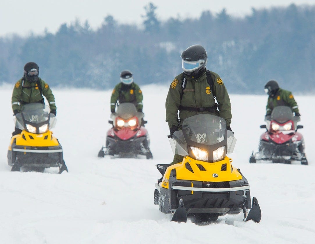 order Patrol Agents often must use snowmobiles along the US-Canada International Boundary. (US Border Patrol photo) order Patrol Agents often must use snowmobiles along the US-Canada International Boundary. (US Border Patrol photo)