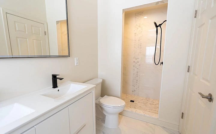 primary bedroom, sitting area and bathroom