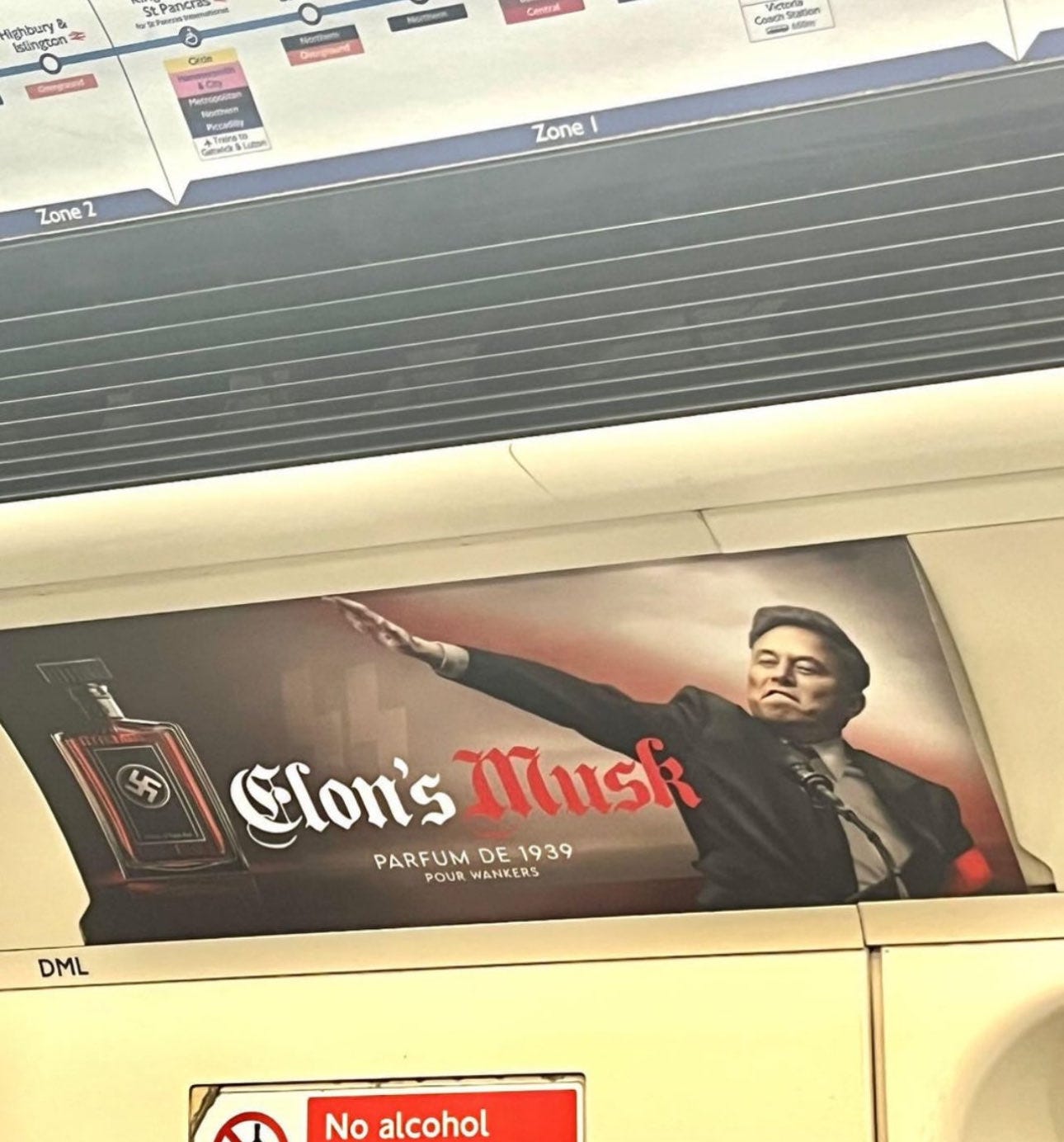 A photograph of the internal walls of a London Underground carriage shows an advert for "Elon's Musk" complete with a picture of the man himself performing a Nazi Saulte and bottle of scent with a swastika emblazoned upon its label and the slogan: "Parfum De 1939 Pour Wankers" A photograph of the internal walls of a London Underground carriage shows an advert for "Elon's Musk" complete with a picture of the man himself performing a Nazi Saulte and bottle of scent with a swastika emblazoned upon its label and the slogan: "Parfum De 1939 Pour Wankers"