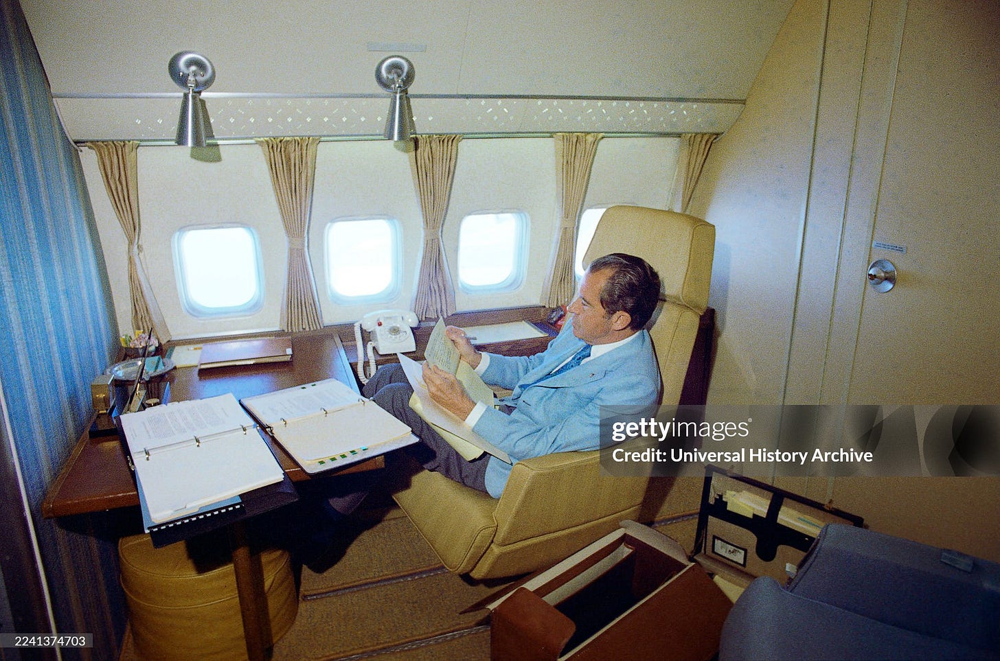 U.S. President Richard M. Nixon seated on board Air Force One inside a private cabin enroute to China, White House Photo Office, February 20, 1972 U.S. President Richard M. Nixon seated on board Air Force One inside a private cabin enroute to China, White House Photo Office, February 20, 1972