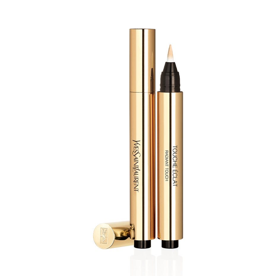 The iconic gold YSL Touche Éclat brightening pen, a sheer liquid highlighter and concealer used to create a dewy, lifted complexion without heavy foundation.