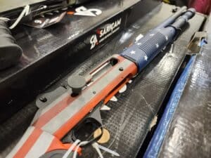A semi-automatic shotgun with an American flag painted on it at a 2023 Virginia gun show A semi-automatic shotgun with an American flag painted on it at a 2023 Virginia gun show