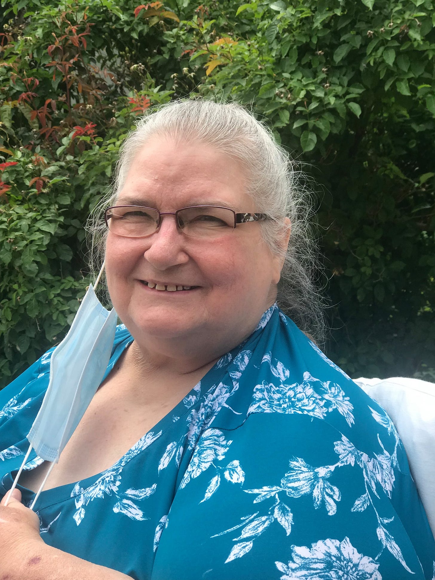 Picture of Jan Nichols outside and smiling.