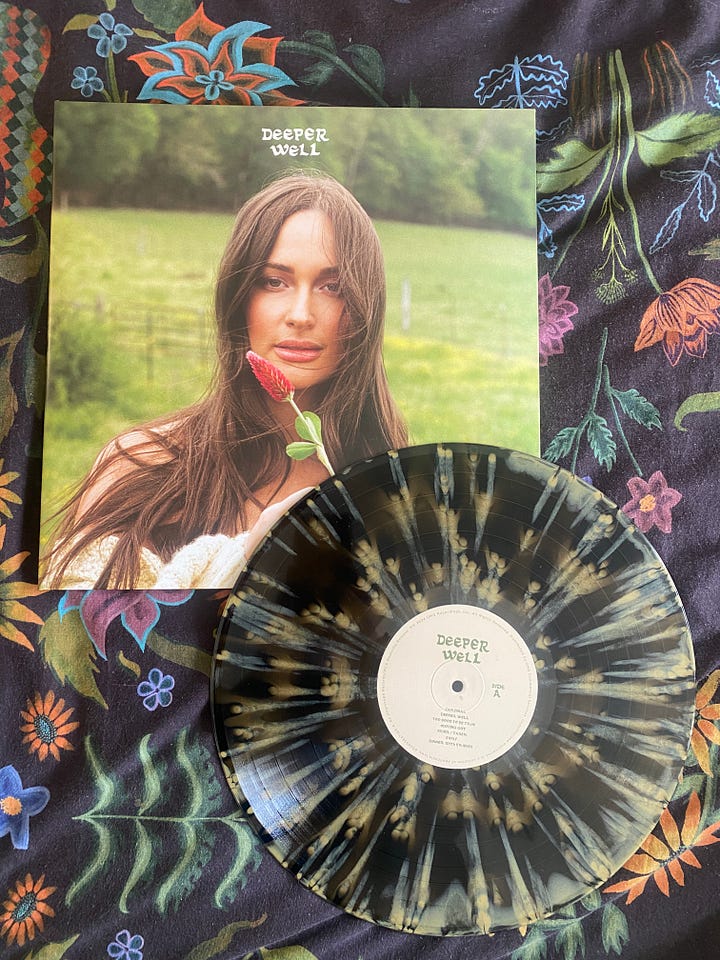 Image one: The front of Kacy's Album, she has her hair flowing down, she's in a field, holding a flower. Image two: the inside of the album, Kacey is in a field with geese