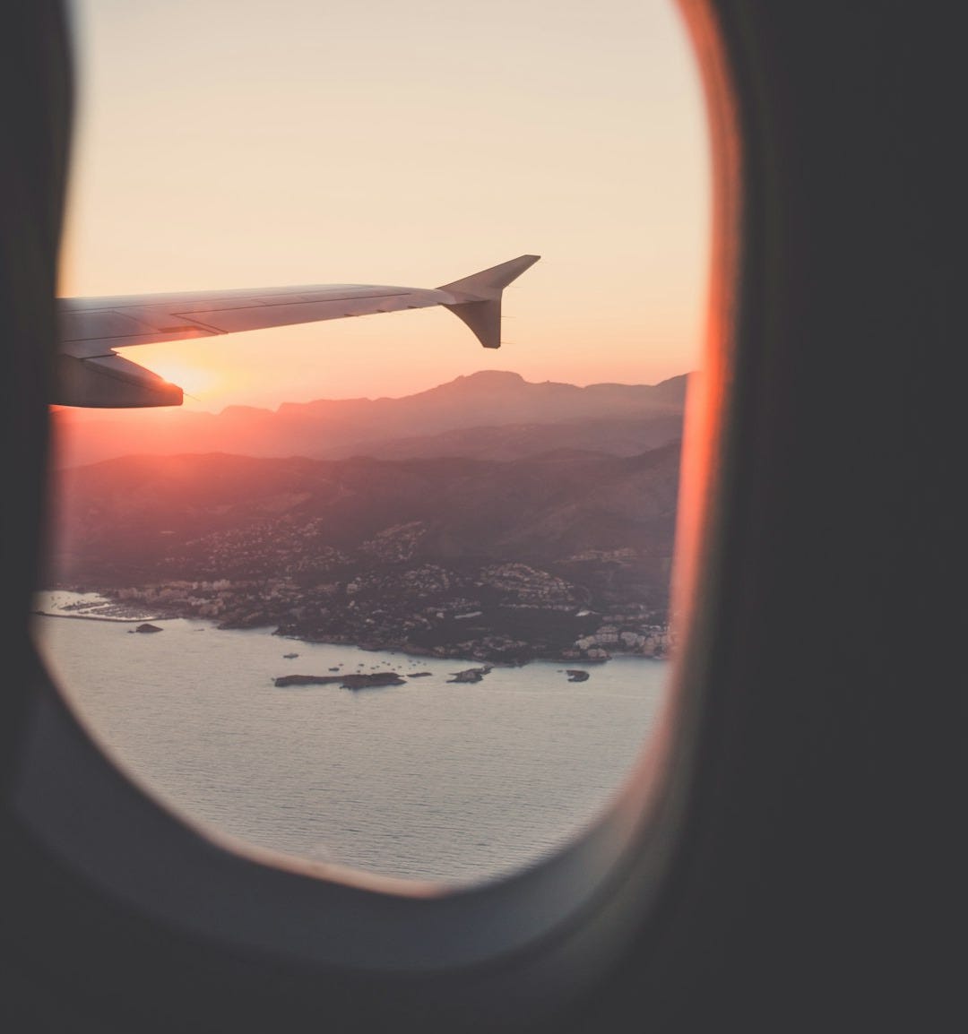 person riding airplane photography