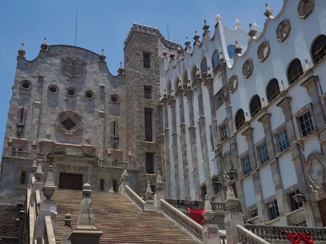 83 steps lead up the entrance of a white university building