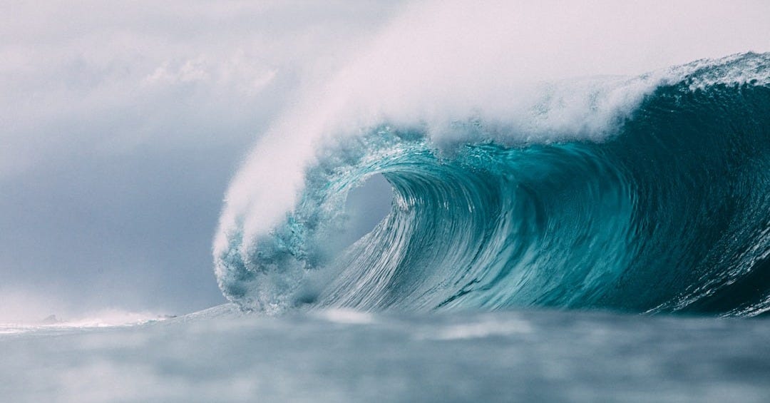 white and blue ocean waves