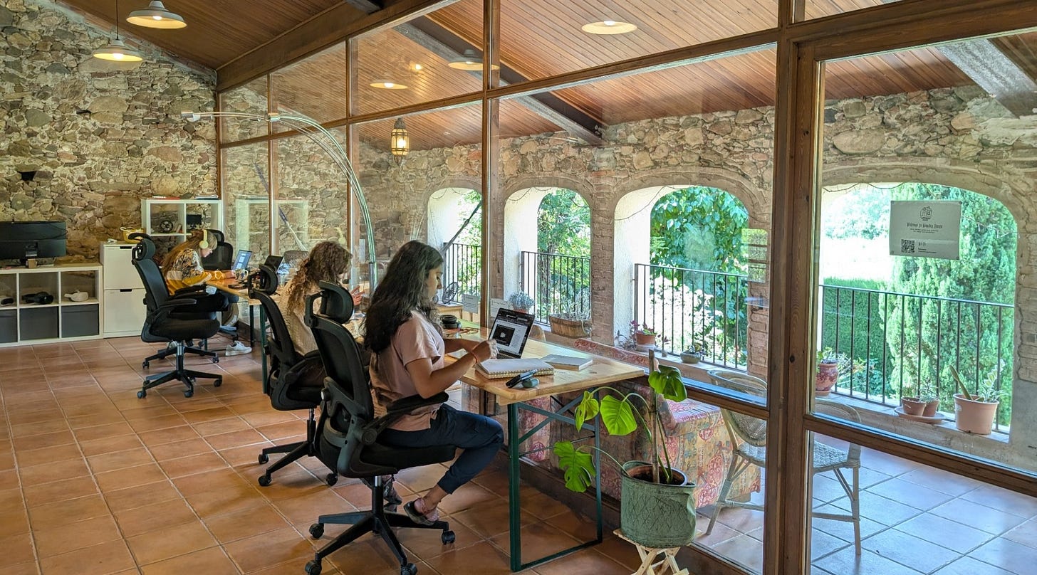 Digital nomads of all ages coworking at Wonder House Coliving in Spain.