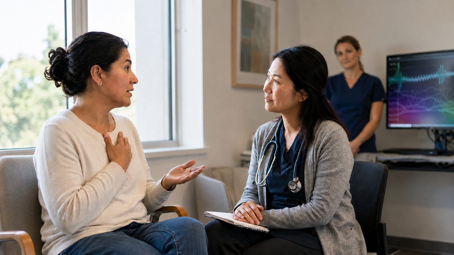 A patient sitting down and having a conversation with a clinician. A patient sitting down and having a conversation with a clinician.