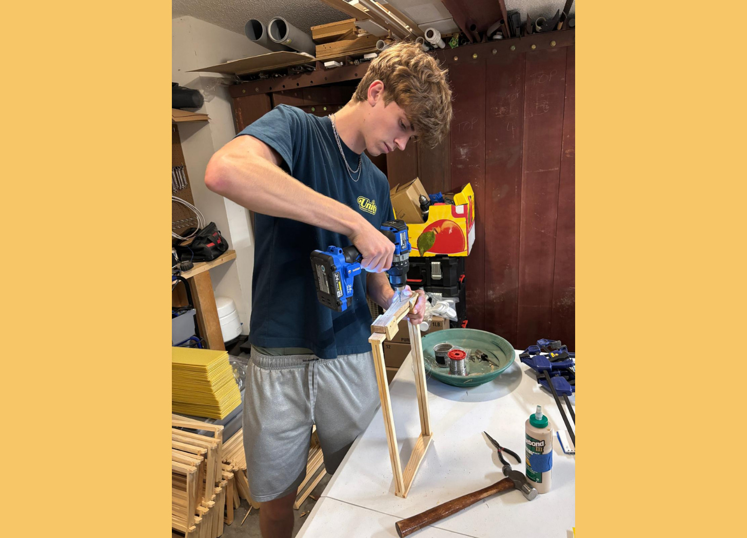 Preston adding wires to bee frame - more on this in a coming post!