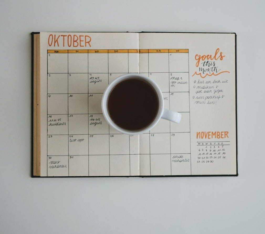 white coffee mug on calendar at october white coffee mug on calendar at october