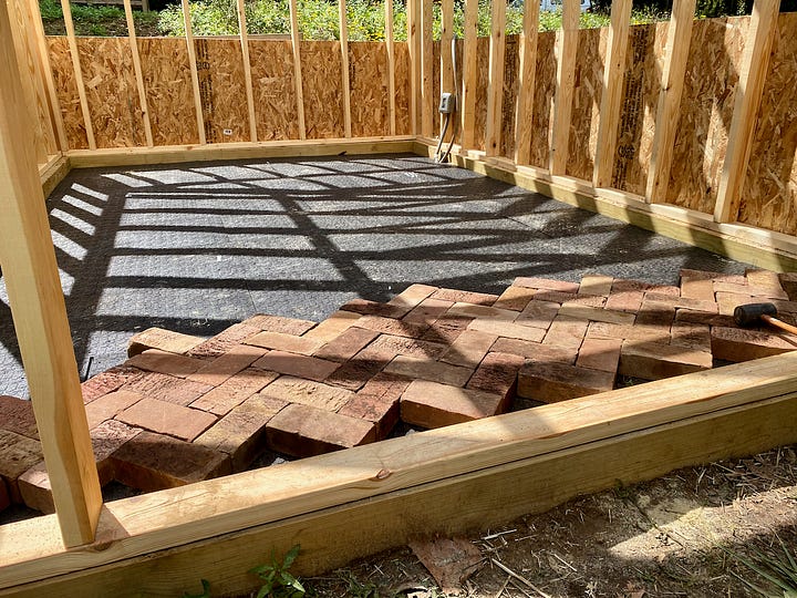 Collage of images showing a brick paver floor being installed.