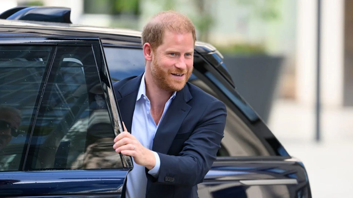 Prince Harry getting out of a car