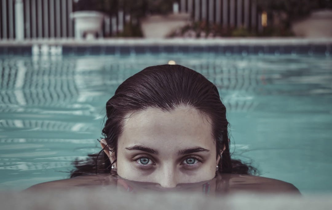 a person in a pool a person in a pool