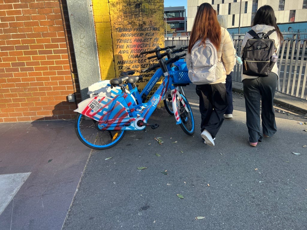 At Redfern Station, forcing pedestrians to walk around even though there is marked bike parking a few meters away.