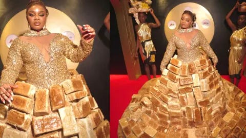 BBC/GIFT UFUOMA Reality TV star Queen Mercy Atang  is seen with her dress made from loaves of bread