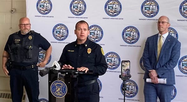 Manchester New Hampshire's police chief, fire chief, and mayor at a press conference