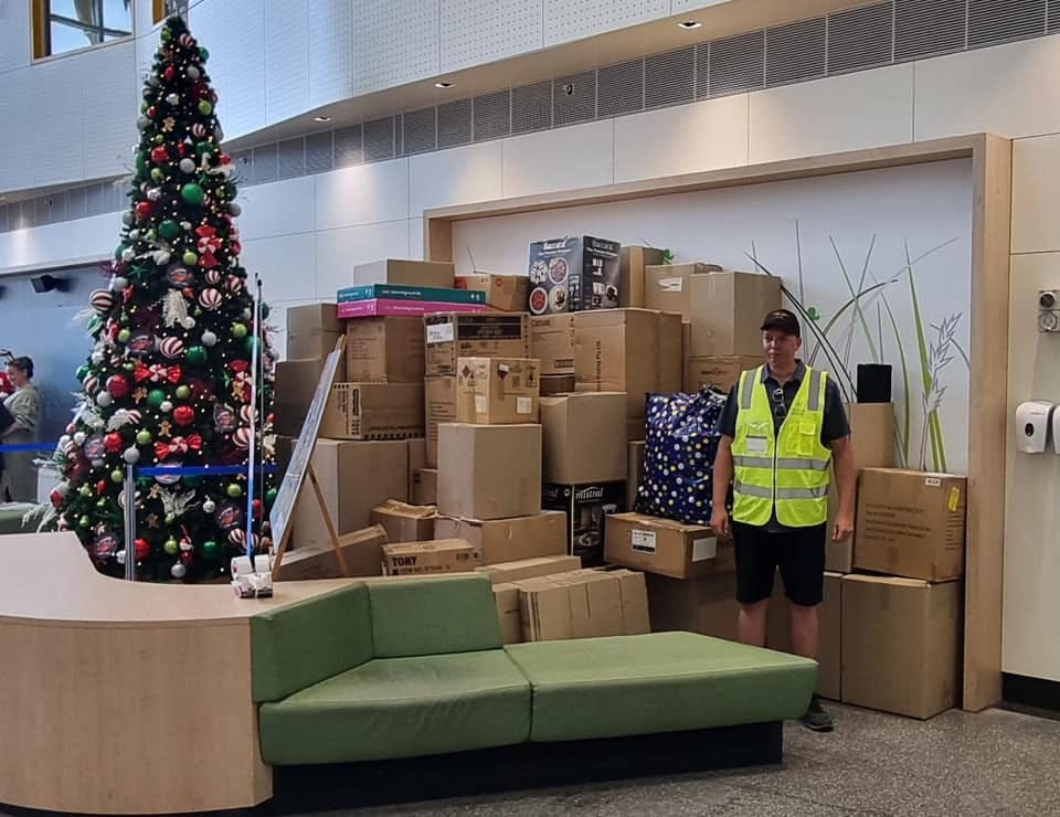 May be an image of 2 people, christmas tree and text