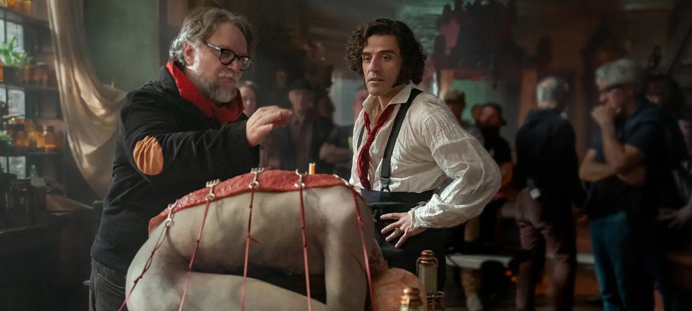 Guillermo del Toro, left, and Oscar Isaac contemplate creation. (Credit: Ken Woroner/Netflix)