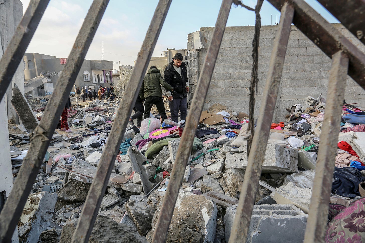 Palestinians collected usable belongings after Israeli air strikes on December 12, 2023 in Rafah, Gaza. (Photo by Abed Rahim Khatib/Anadolu via Getty Images.) Palestinians collected usable belongings after Israeli air strikes on December 12, 2023 in Rafah, Gaza. (Photo by Abed Rahim Khatib/Anadolu via Getty Images.)