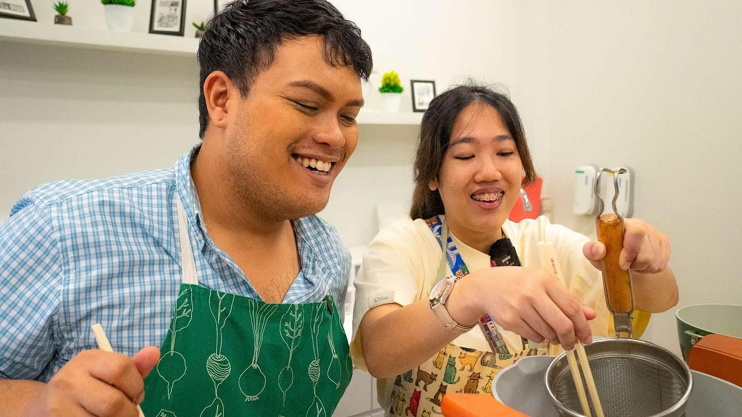 smiling and cooking together