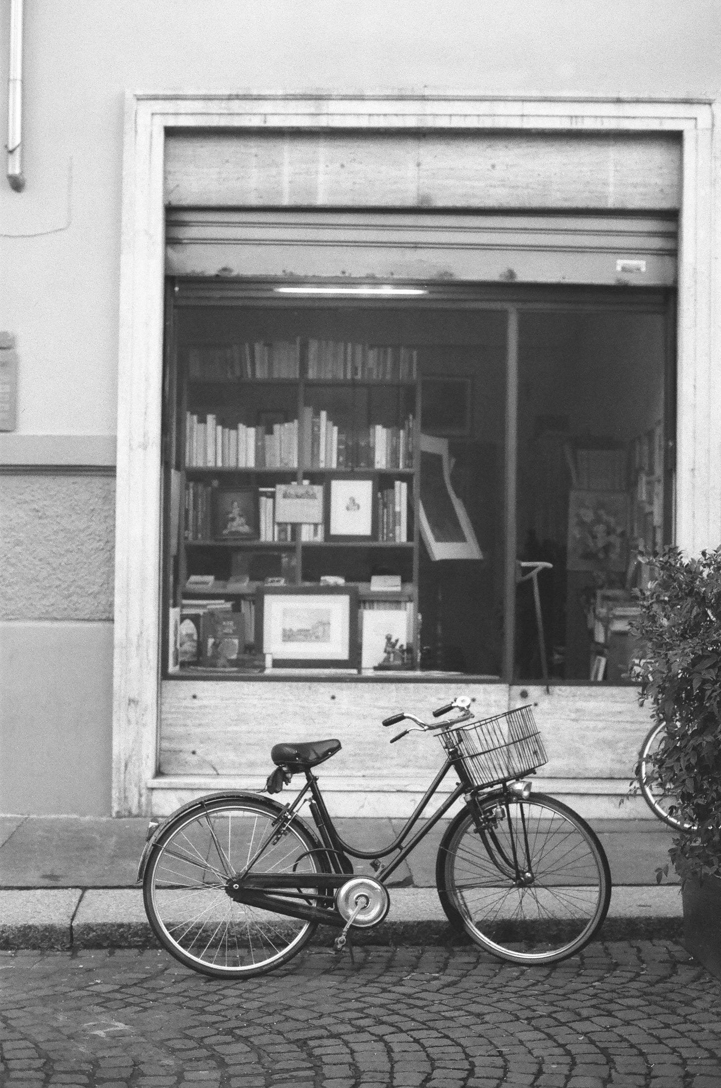 city bike with basket in front of bookstore city bike with basket in front of bookstore