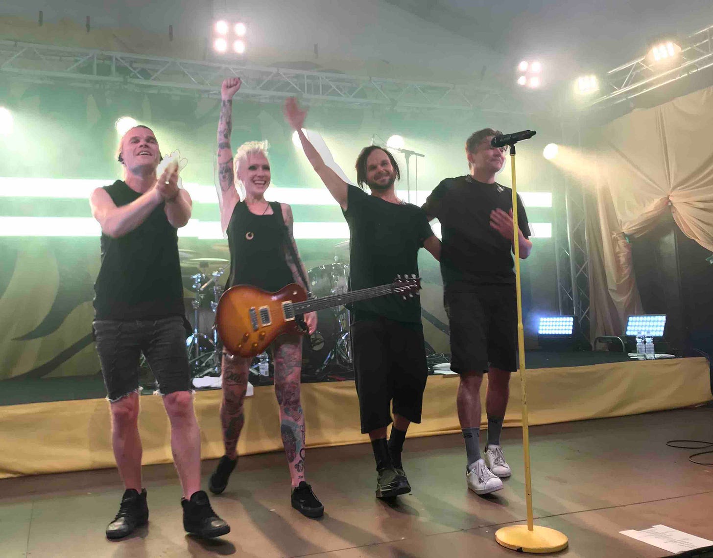 Finnish rock band The Rasmus on stage at the end of a gig, thanking the audience