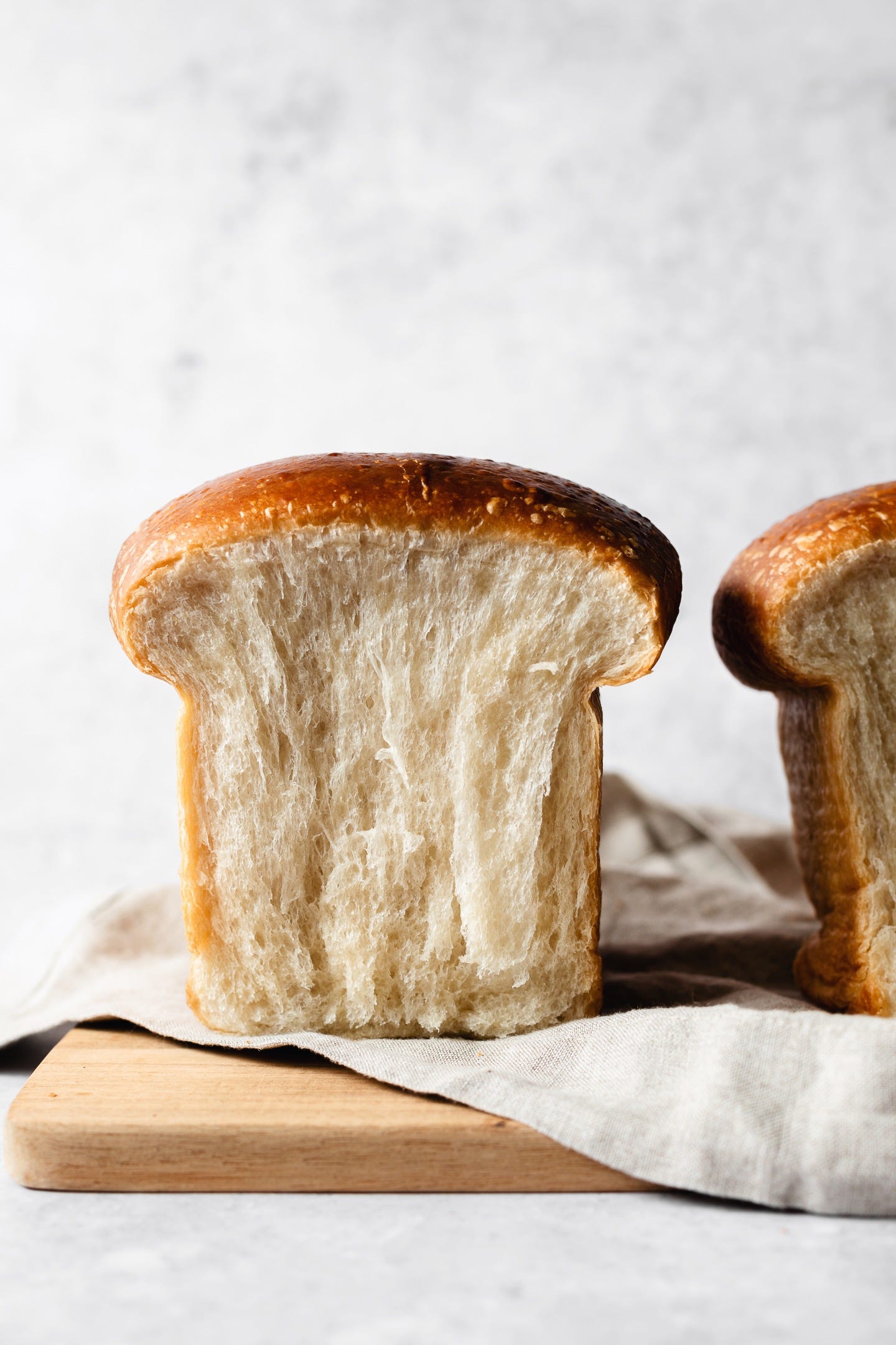 Vegan milk bread loaves on grey background