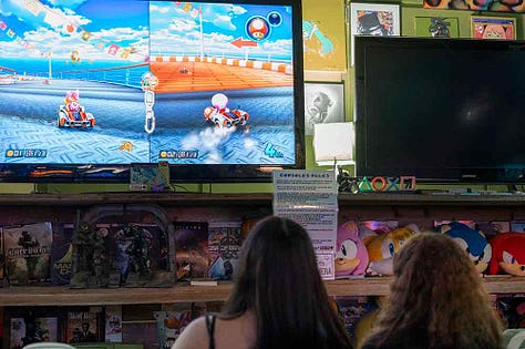 Gamers enjoying themselves at Maniac's Mansion