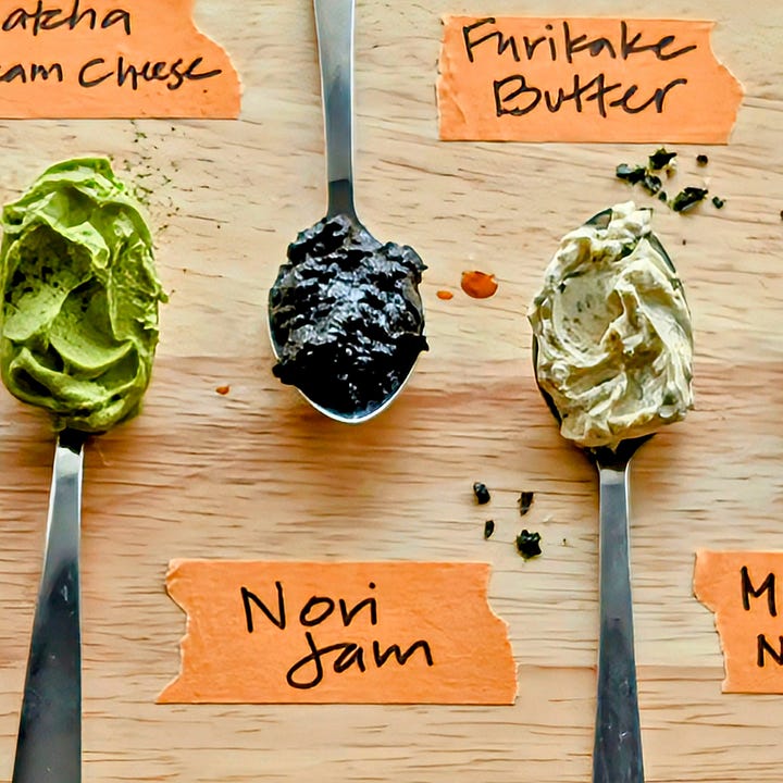 A spoonful of dark, glossy Nori Jam with other spreads blurred in the background, alongside a dish of blistered shishito peppers topped with generous spoonfuls of the jam.