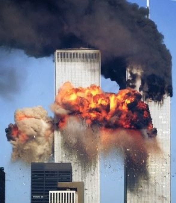 Two tall towers of the World Trade Center engulfed in flames and smoke. Explosions with bright orange fire and dark smoke are visible, impacting the structures.
