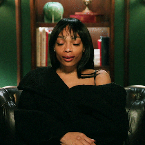 A black woman shrugging