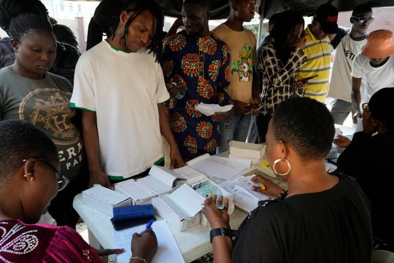 People wait to collect their elections permanent voters card ahead of Feb. 2023 Presidential elections in Lagos, Nigeria, Wednesday, Jan. 11, 2023. (AP Photo/Sunday Alamba) People wait to collect their elections permanent voters card ahead of Feb. 2023 Presidential elections in Lagos, Nigeria, Wednesday, Jan. 11, 2023. (AP Photo/Sunday Alamba)