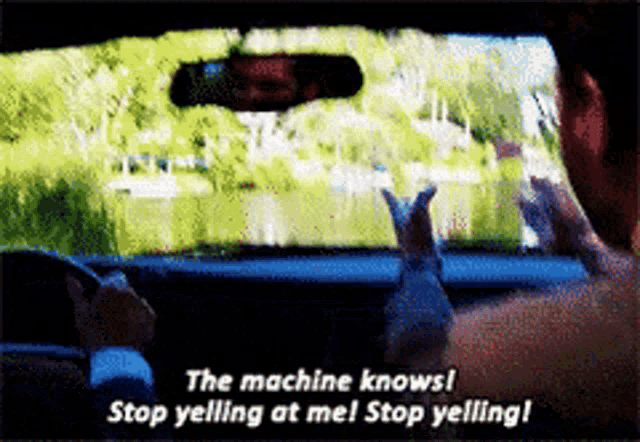 a man in a car says " the machine knows "
