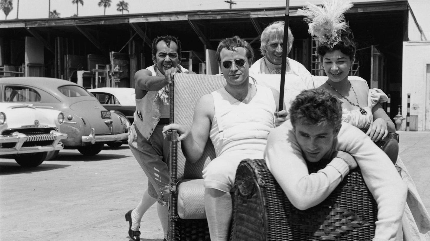 Marlon Brando (center) and James Dean (front) on the 20th Century Fox lot in 1954.