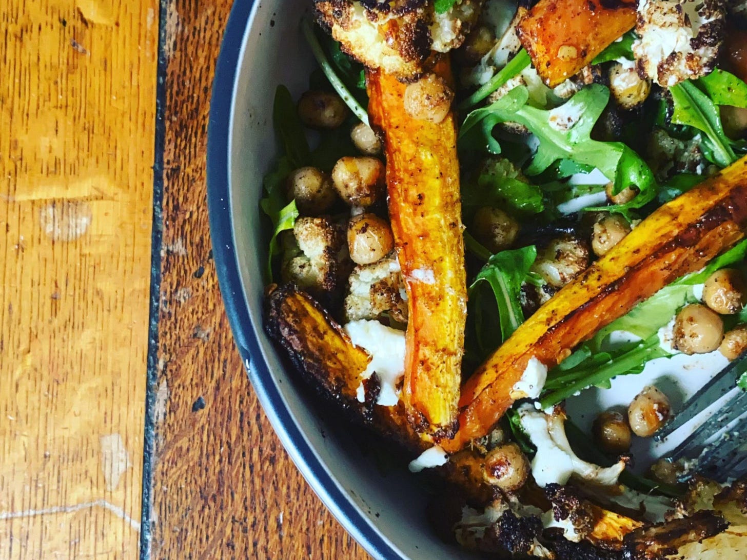 Salad bowl of roasted vegetables, chickpeas and rocket