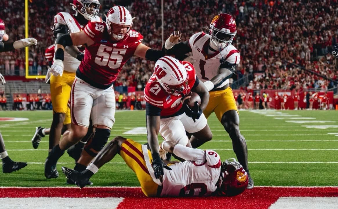 Wisconsin running back Bryan Jackson (#21) fights through USC defenders to score a touchdown during the Badgers’ 24-7 win over the Trojans. Wisconsin running back Bryan Jackson (#21) fights through USC defenders to score a touchdown during the Badgers’ 24-7 win over the Trojans.