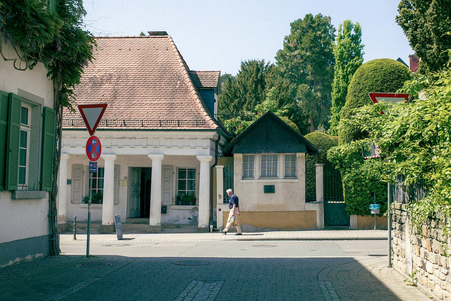 a man walking down a street holding something