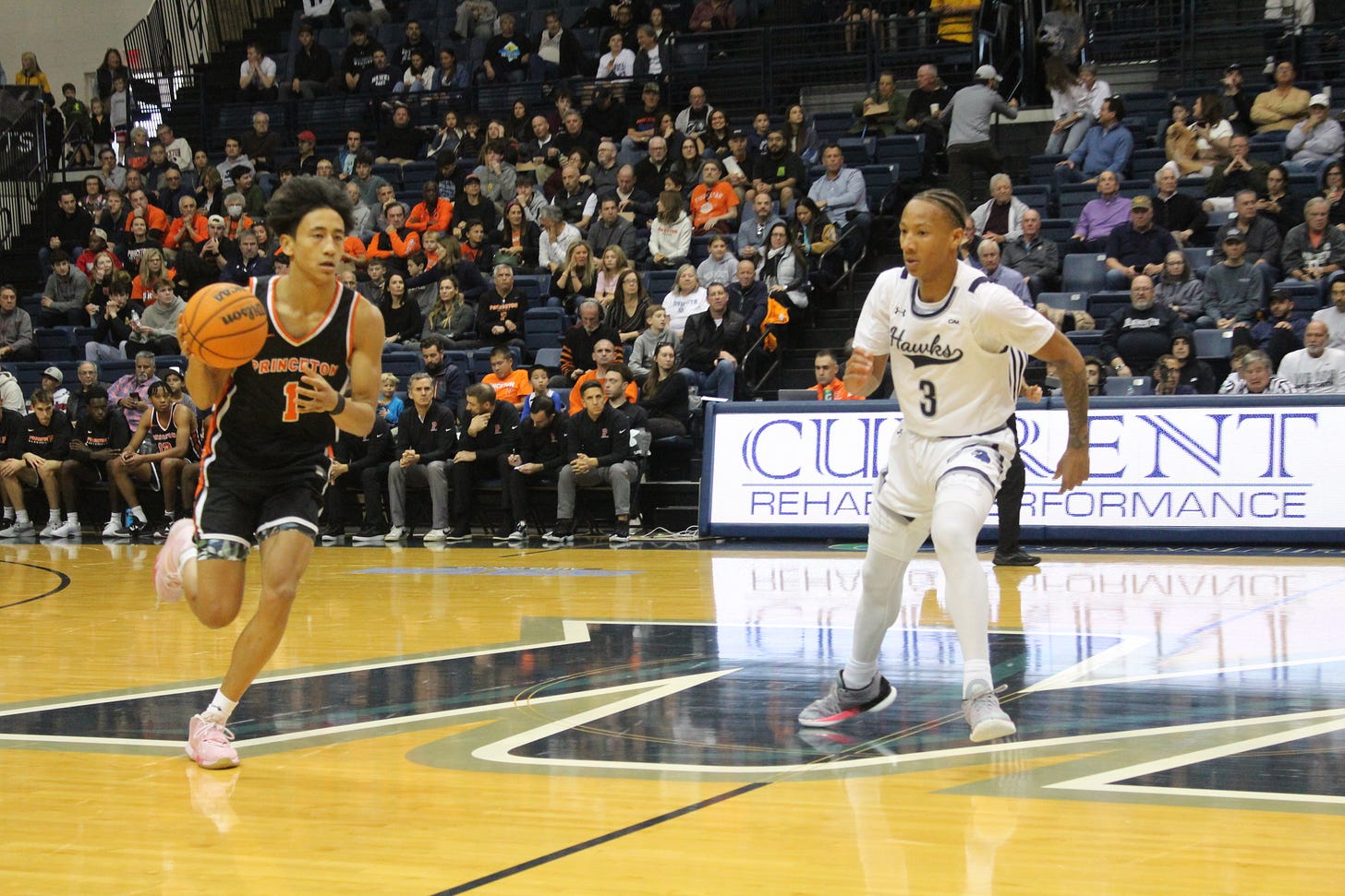 Princeton’s Xaivian Lee takes the ball up the court against Monmouth’s Jakari Spence on Nov. 18, 2023. (Photo by Adam Zielonka) Princeton’s Xaivian Lee takes the ball up the court against Monmouth’s Jakari Spence on Nov. 18, 2023. (Photo by Adam Zielonka)
