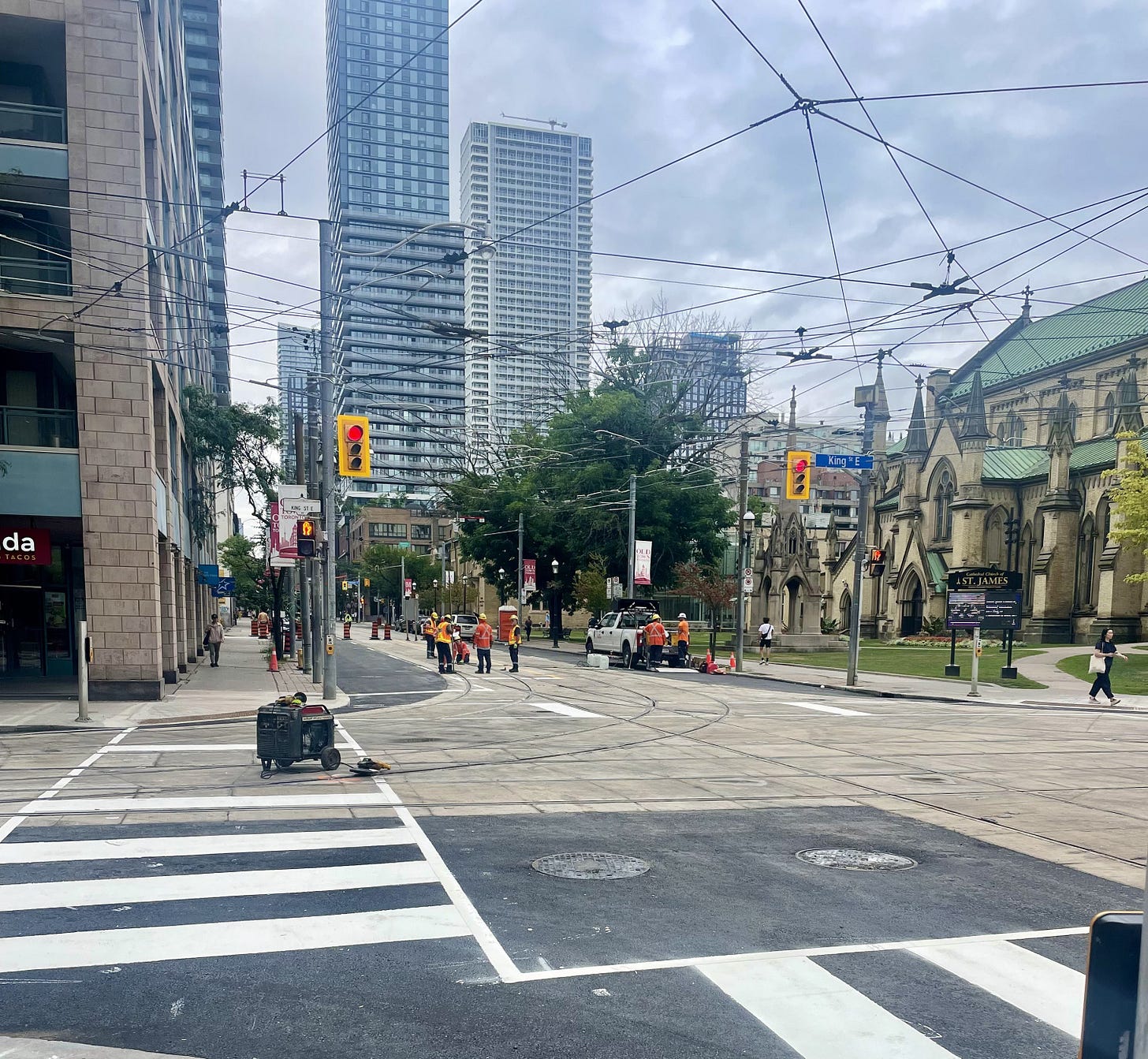 Toronto construction crews finishing streetcar track repairs at King and Church, featured in Beating the Tide Weekly 43 Thought of the Week on aligning principal–agent incentives in investing and life.
