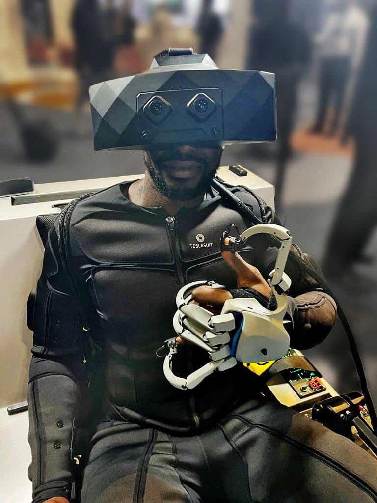 May be an image of 1 person and text that says 'TESLASUIT'