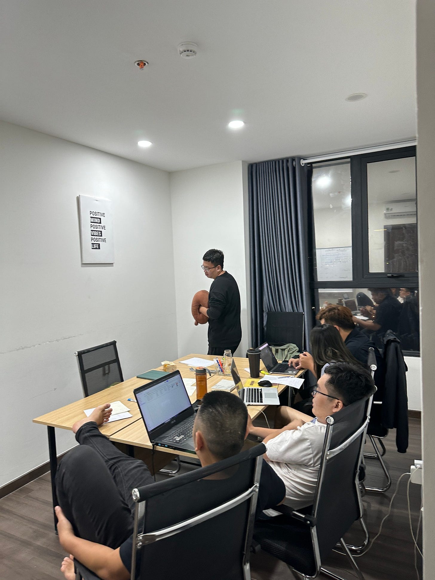May be an image of 5 people, people studying and table
