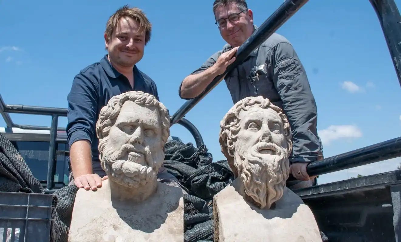 The archaeologists with the sculptures. The archaeologists with the sculptures.