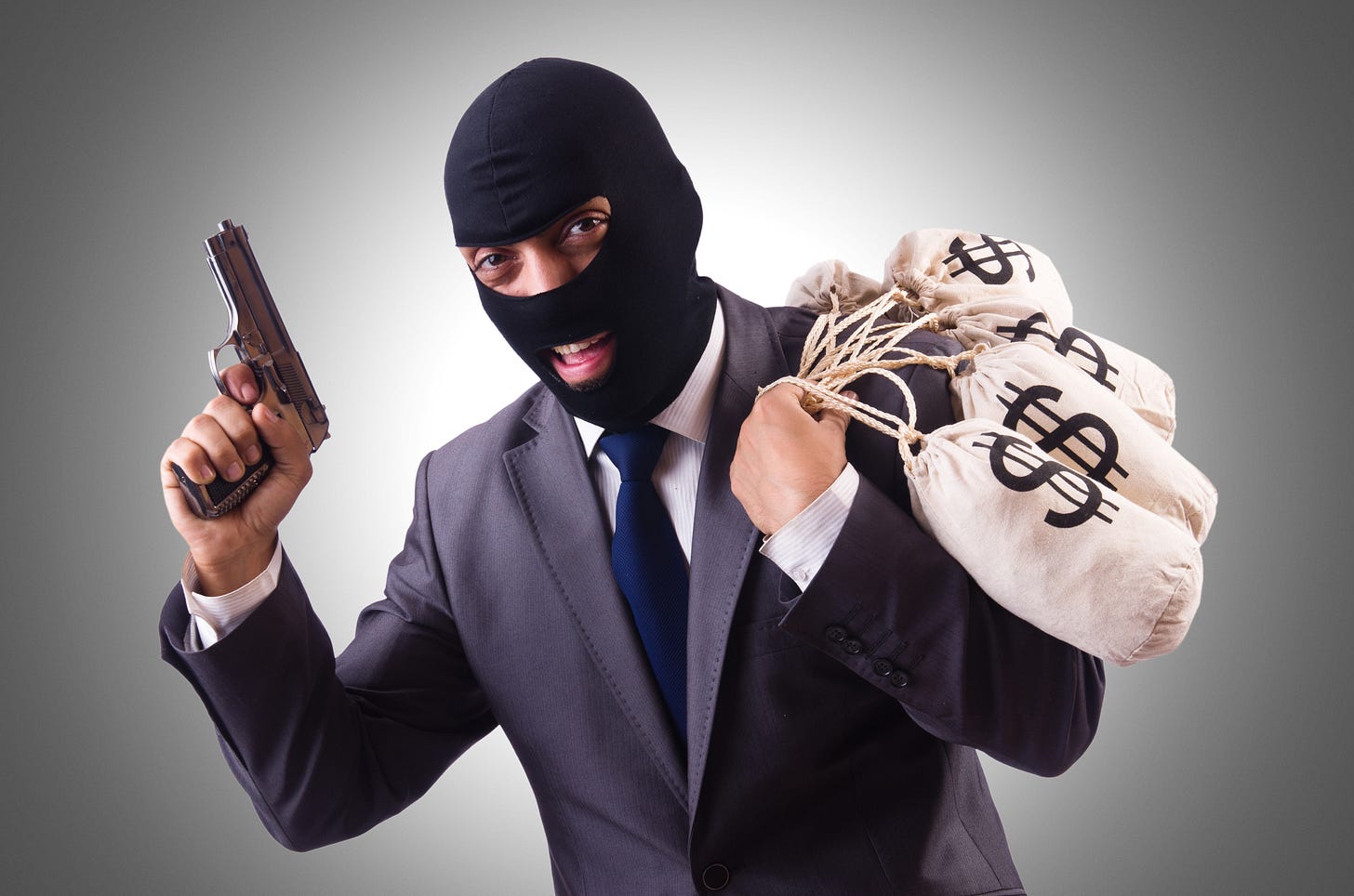 image of bank robber holding a bag of cash