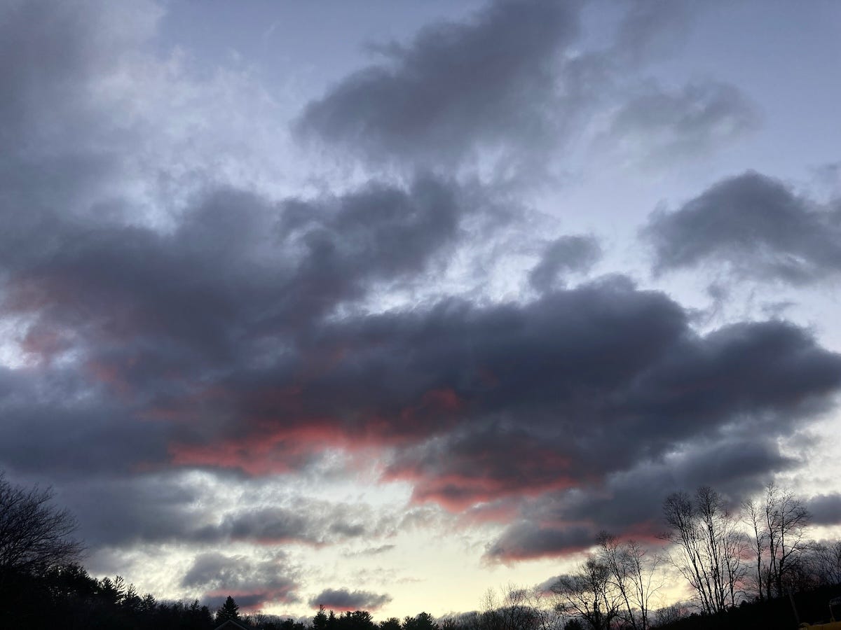 clouds at sunset, some red, looking stormy and ominous clouds at sunset, some red, looking stormy and ominous