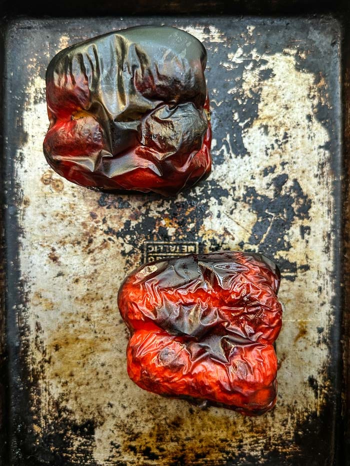 Sweet roasted red peppers marinated with garlic, herbs, and olive oil. An easy make-ahead recipe for sandwiches, salads, and snack boards. Full recipe on Shutterbean. Sweet roasted red peppers marinated with garlic, herbs, and olive oil. An easy make-ahead recipe for sandwiches, salads, and snack boards. Full recipe on Shutterbean.