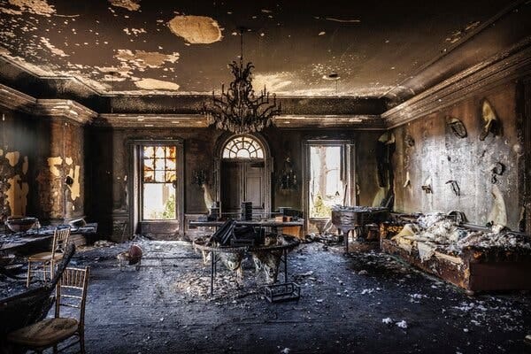 A large room with significant burn damage.