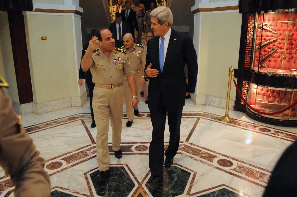 General Abdel Fattah el-Sisi meets U.S. Secretary of State John Kerry in Cairo — months before the coup that would make him president.