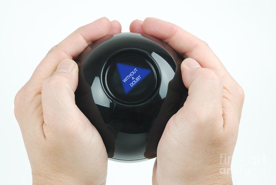 Hands holding a Magic 8 Ball showing the answer “Without a doubt.”