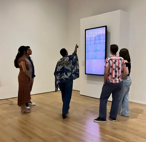 Visitor interacting with the art at the Run the Code exhibit